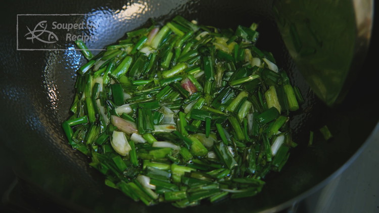 Image of Dice 8 scallions into 1/2 inch long pieces. Add the scallions to a wok along with 1/4 cup of vegetable oil. Carefully fry over low heat for 8-10 minutes. You can stir once every 30 seconds to prevent burning.