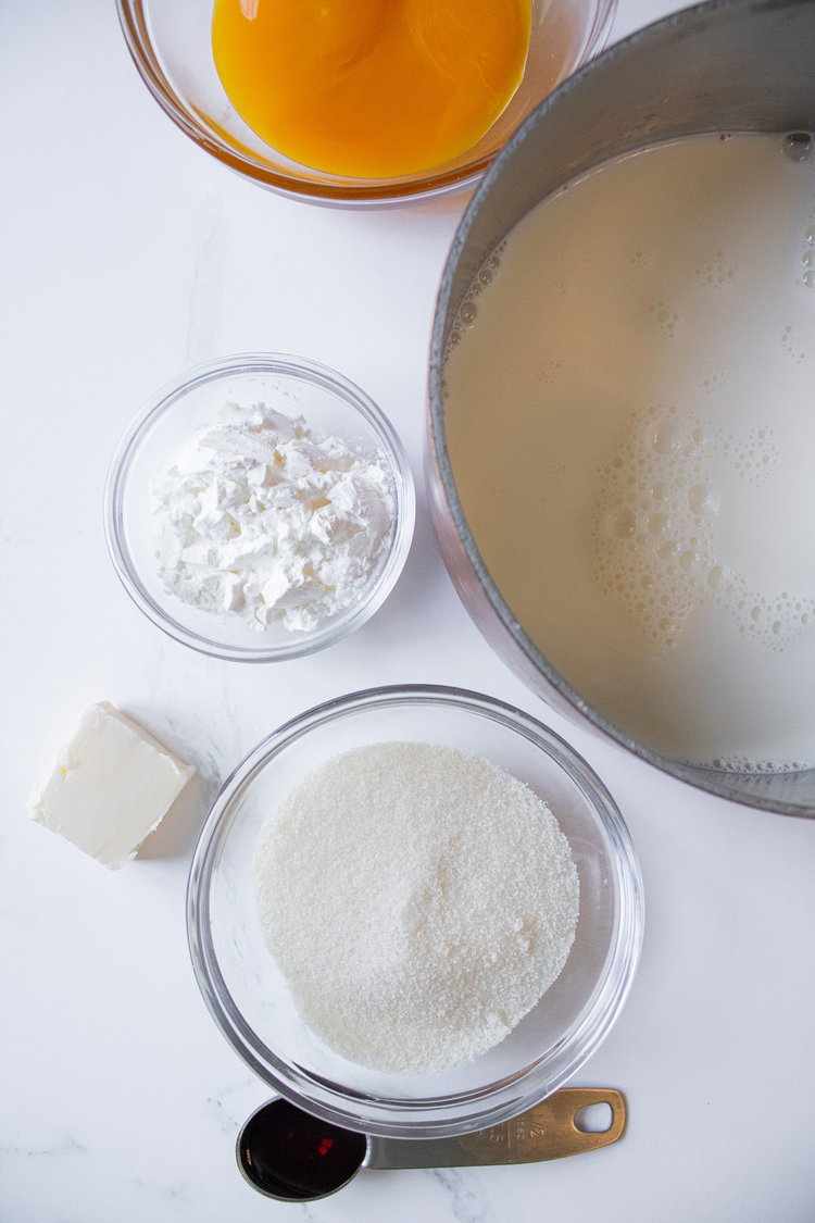 Image of Mix together milk, butter, egg yolks and vanilla  until melted