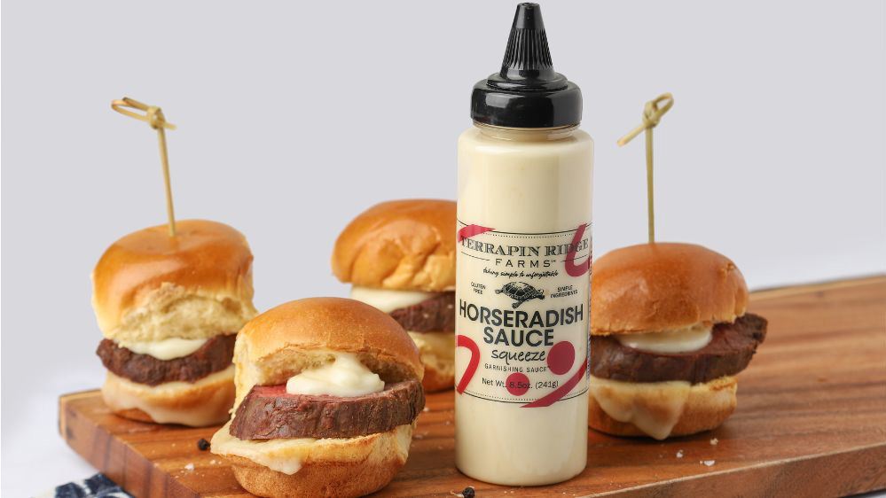 Image of Beef Tenderloin Sliders with Horseradish Sauce Garnishing Squeeze