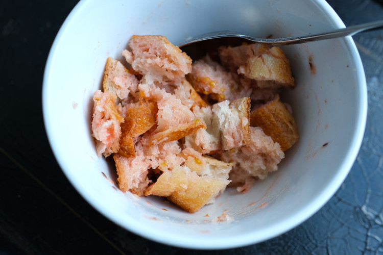 Image of Read in full before proceeding:  your goal is to soak the stale bread cubes in a bowl with the tomato water/vinegar.  If you think you don’t have enough tomato water or just don’t have time for the tomatoes to toss...