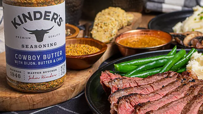  Sliced grilled ribeye steak drizzled with cowboy butter sauce