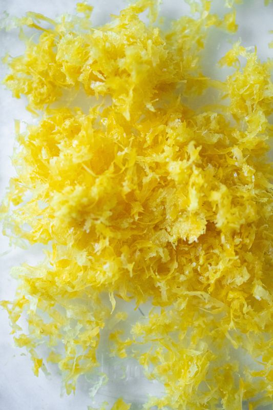 Image of Zest the lemons with the sugar and mix together