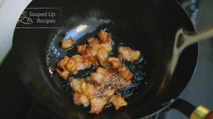 Image of Turn the heat to high and preheat the wok until smoking hot. Drizzle a little cooking oil into the wok to lubricate the bottom, then add the pork belly. Switch the heat to medium-low and stir for a few minutes...