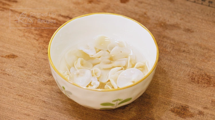 Image of Optionally, soak the wood ear mushrooms in clean water for 20 minutes or until rehydrated. I used white wood ear mushrooms in this recipe, but they can be replaced with black wood ear mushrooms, as both of them have the...