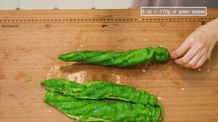 Image of Smack the green peppers a few times to create bruises. Then cut them into bite-sized pieces. This dish is usually made with what's called screw peppers (螺丝椒) in China, which have a twisted shape, crunchy texture, and mild heat. Banana...