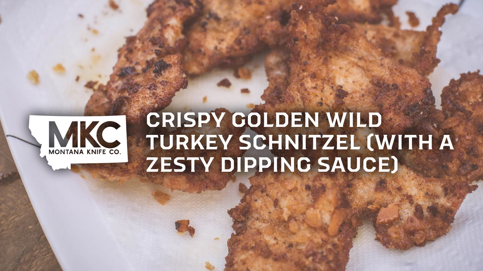 Several pieces of crispy, golden-brown breaded turkey schnitzel on a paper towel or napkin.