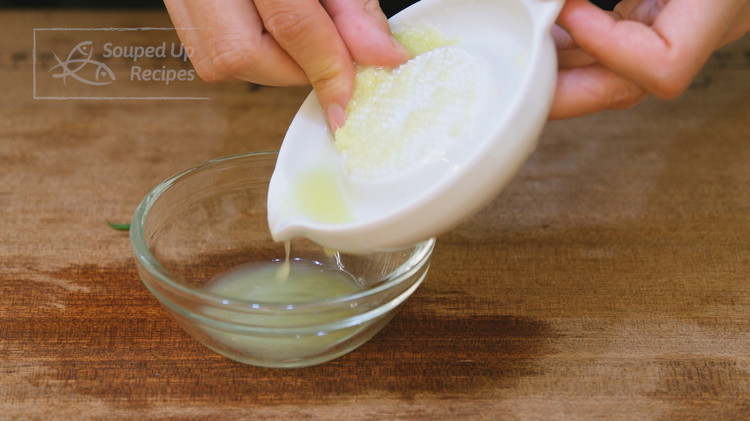 Image of Grate 1 inch of ginger. Then add 1.5 tsp of water to the ginger and squeeze to get the juice.
