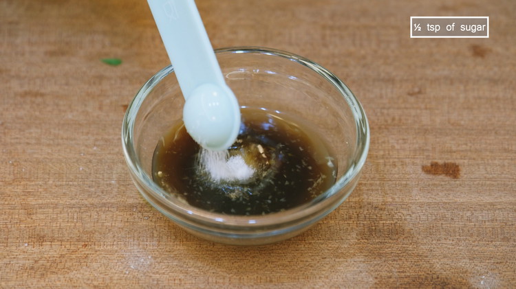 Image of Combine the ginger juice with 1 tbsp of fish sauce, 1/2 tbsp of soy sauce, and 1/2 tsp of sugar and stir well. Gailan has a slightly bitter taste. A little bit of sugar helps to balance the flavor.