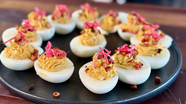 Image of then top with crispy bacon and pickled cabbage 