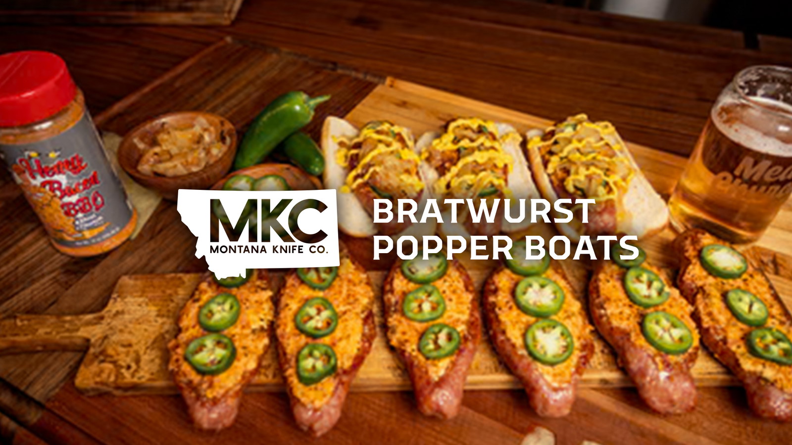 Sausage popper boats filled with creamy cheese and jalapeños smoked to golden perfection.