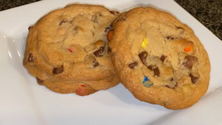 Thick, golden-brown cookies studded with colorful M&M candies, crisp on the edges and soft in the center.