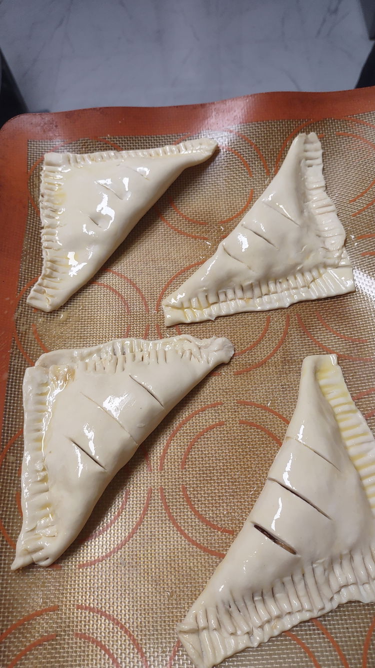 Image of Cut 2–3 small slits in the top of each turnover...