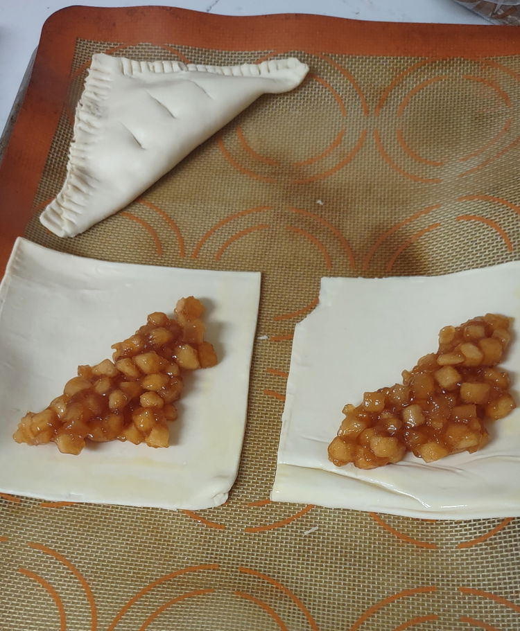 Image of Place a spoonful of apple filling in the center of...