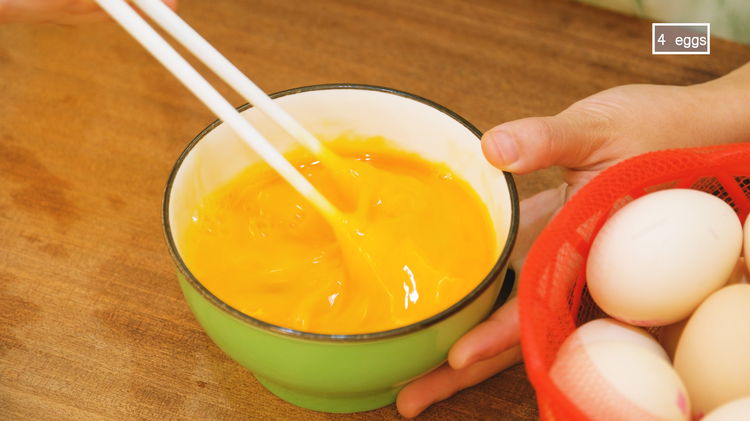 Image of Crack 4 eggs into a bowl and beat well. 