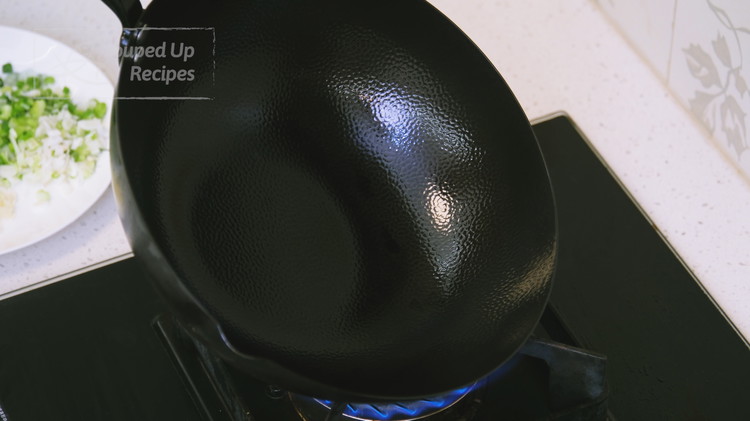 Image of Turn the heat to maximum. The most important step when making fried rice is preheating your wok. Since home stoves aren't as powerful as commercial ones, tilt the wok in all directions so the entire surface heats evenly and thoroughly....