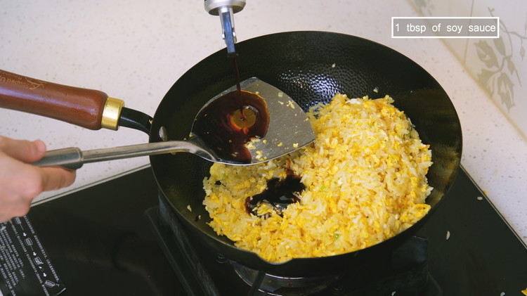 Image of Season the fried rice with 1 tbsp of oyster sauce and 1 tbsp of soy sauce.