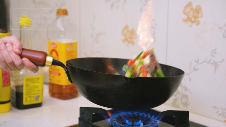 Image of If you have a powerful gas stove, you may be able to create dramatic flames as while tossing. Don’t be afraid, the flames are important to capture the elusive “wok hei” into your stir fry. The flames kiss the ingredients directly,...