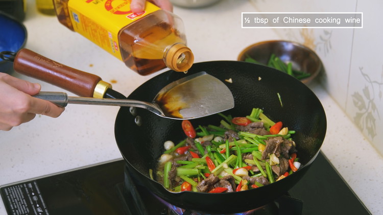 Image of Add 1/2 tbsp of oyster sauce, 1/2 tbsp of soy sauce and 1/2 tbsp of Chinese cooking wine. Make sure you splash the seasonings to the side of the wok and mix well. Last toss in the scallion greens and...