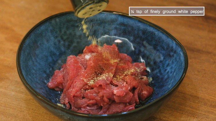 Image of Slice the beef into 1/8 of an inch thick piece then marinate it with 1/2 tbsp of soy sauce, 1/4 tsp of salt, and 1/4 tsp of finely ground white pepper. Mix well. I recommend using beef loin or tenderloin....