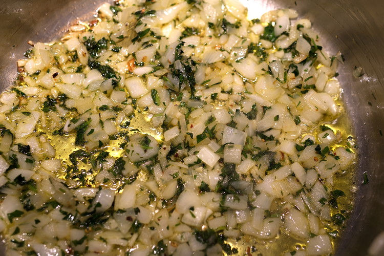 Image of Allow the allium and herb mix to cook on medium heat stirring occasionally.  You want the onions to begin to soften and become somewhat translucent but you do not want them to brown