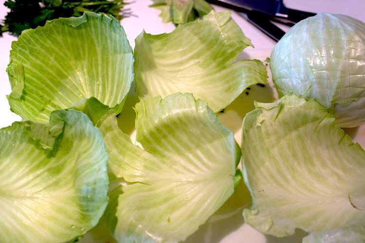 Image of Carefully remove 8 outer leaves and reserve them to roll your hot dogs