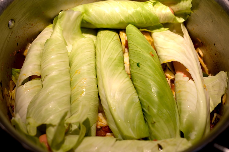 Image of Place the rolled dogs on top of your stewing mixture in a single layer if possible.