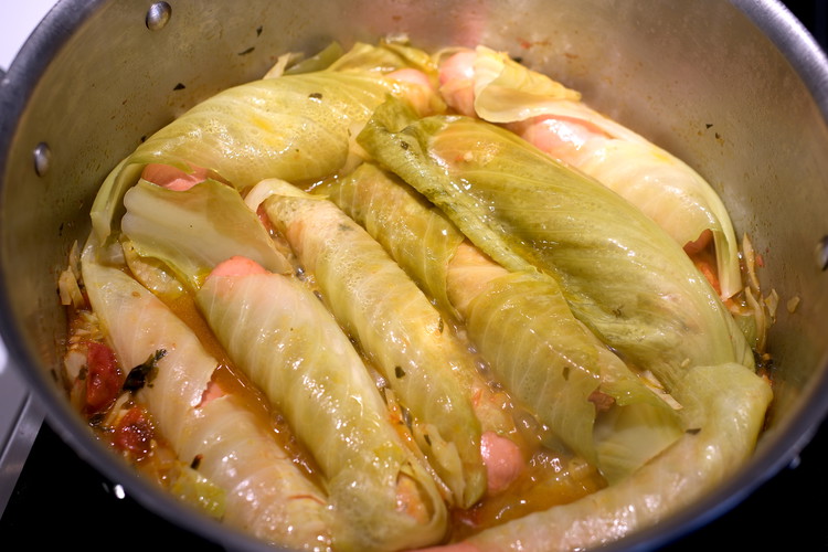 Image of Uncover and with a spoon see if you can nudge the dogs and the sauce (will be liquidy/chunky enough to move) so that the top layer of the wrapped dogs sink into the sauce a bit more. This is also...