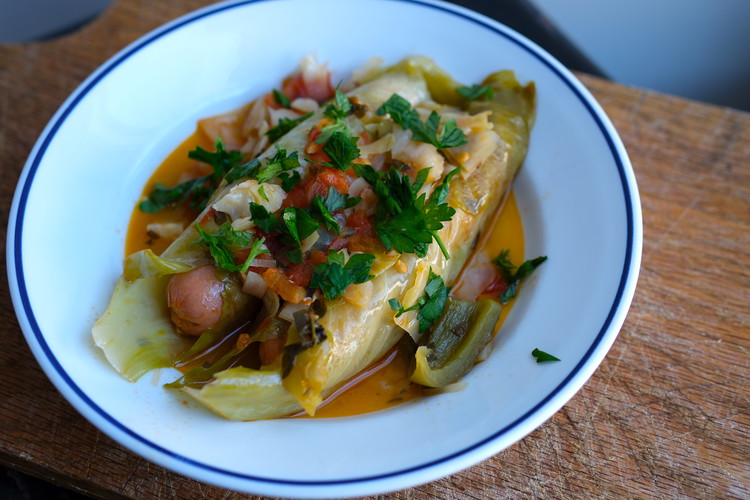 Image of Plate by carefully placing wrapped dogs on a plate and then spooning some of the chunky sauce on top.  You can then add chopped herbs (eg parsley) on top for a brighter visual.  Serve with buttered white rice.