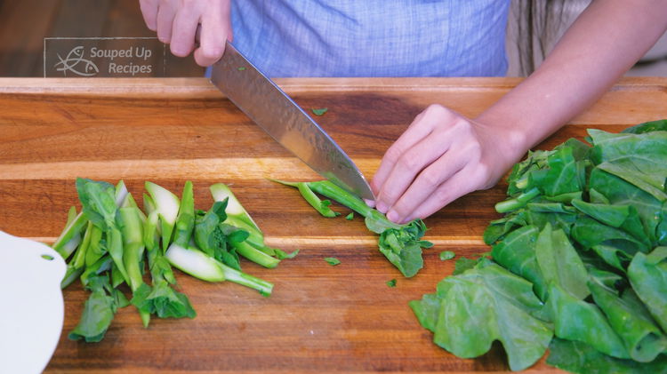 Image of Cut the Chinese broccoli on a 45-degree angle into 2-inch-long...