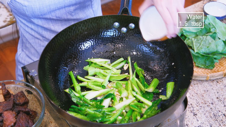Image of Add the minced garlic, ginger, and the broccoli stem to...
