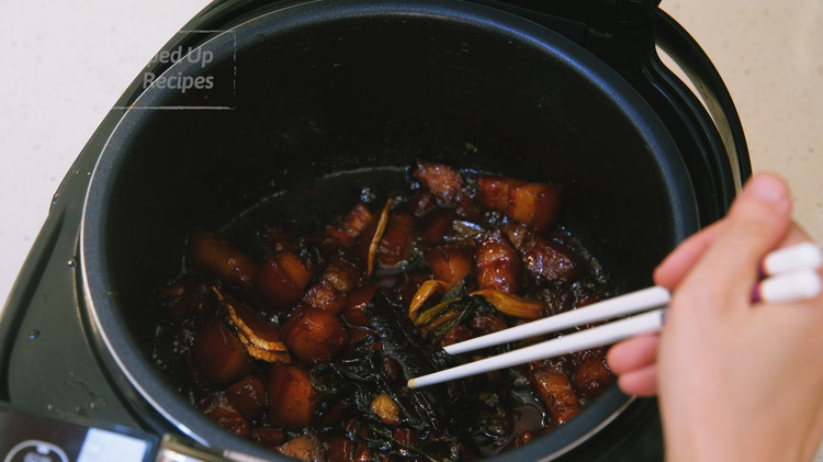 Image of Remove the scallions, ginger, cinnamon, and bay leaves, and serve with white rice.