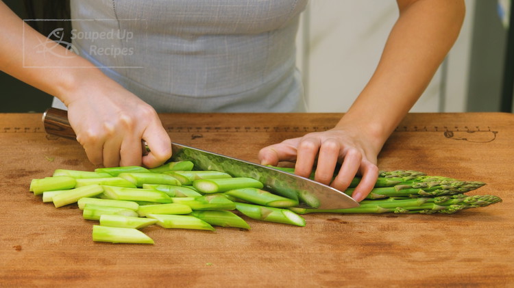 Image of Discard the asparagus ends. Then cut them diagonally into 2-inch-long pieces.