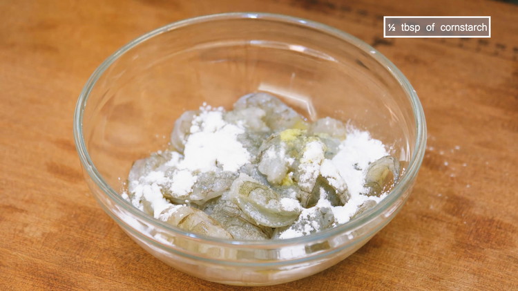 Image of Grate 1/2 inch of ginger into a paste, then add 1/2 tbsp of Chinese cooking wine and squeeze the juice into the shrimp. Continue by adding 1/4 tsp of salt, 1/4 tsp of sugar, and 1/2 tbsp of cornstarch, and...