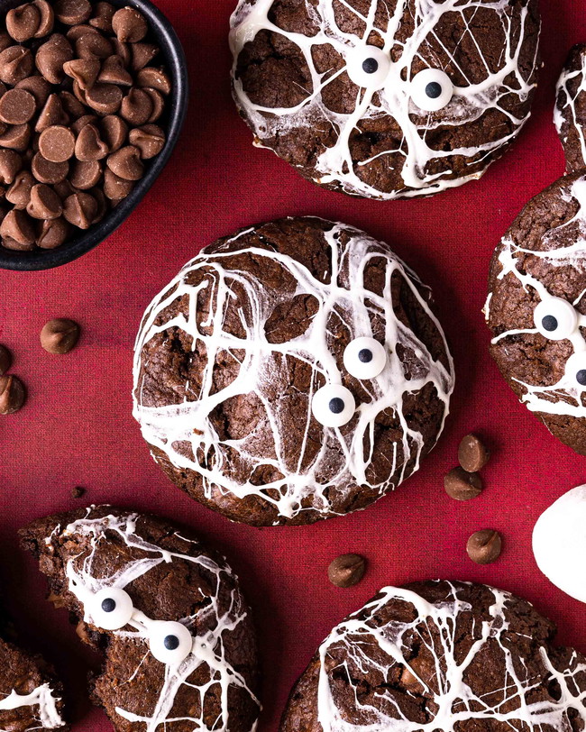 Spooky Double chocolate Cookies decorated with googly eyes and sugar