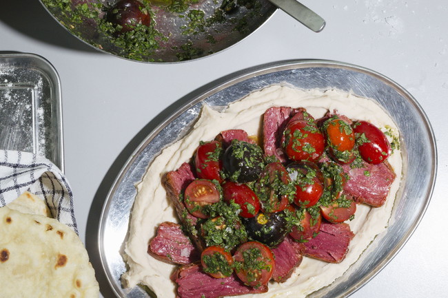 Image of  Meaty Meat on Creamy Bean Puree with Herby Marinated Tomatoes