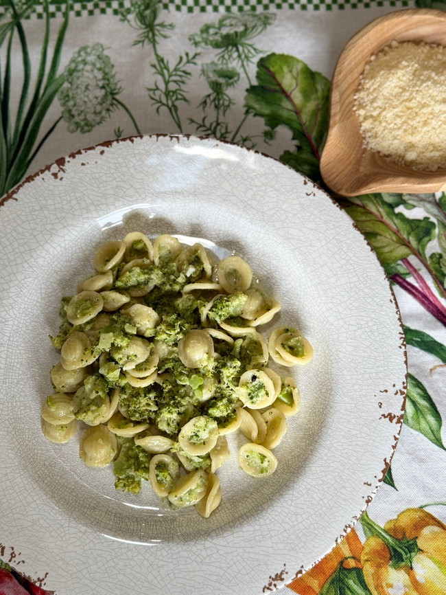 Plate of broccoli pasta with parmigiano reggiano 