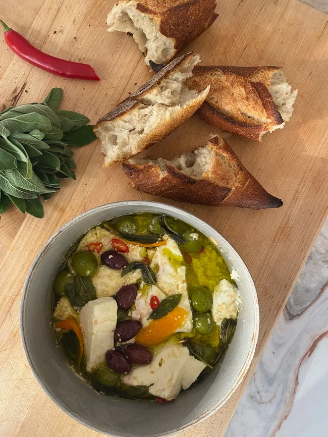 Image of Baked feta with olives, sesame, sage & honey