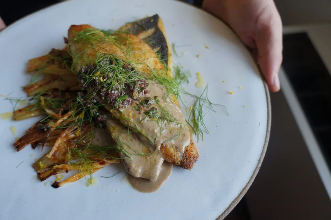 Image of Aleppo Roasted Fennel With Pan Seared Sea Bass, Tapenade & Raw Tahini