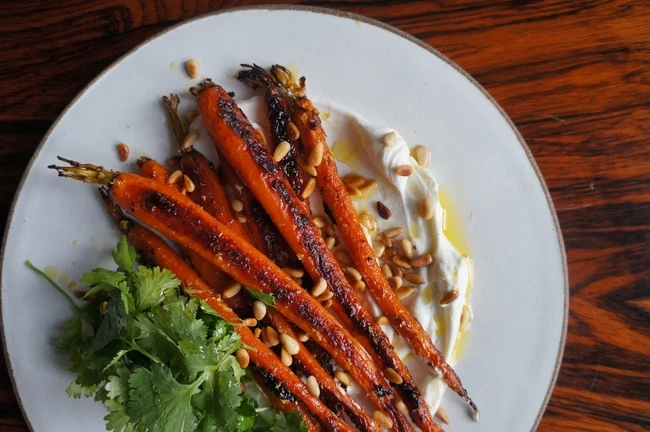 Image of Harissa roasted carrots with yogurt, pine nuts and fresh herbs