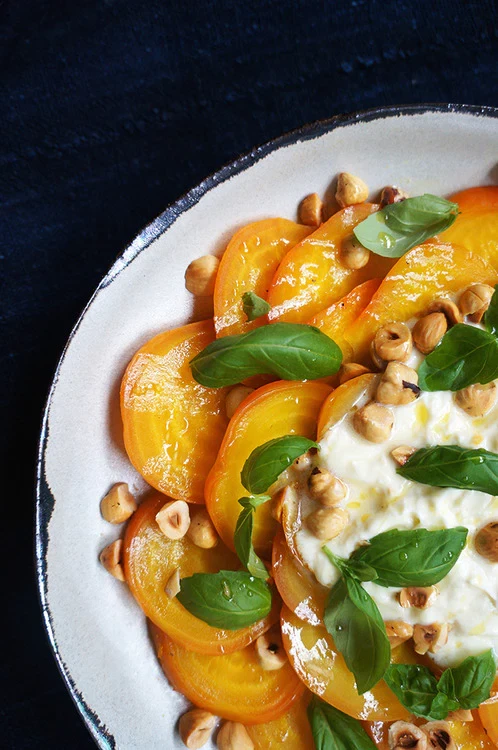 Image of Yellow beets with lemony creme fraiche, fresh basil and toasted hazelnuts