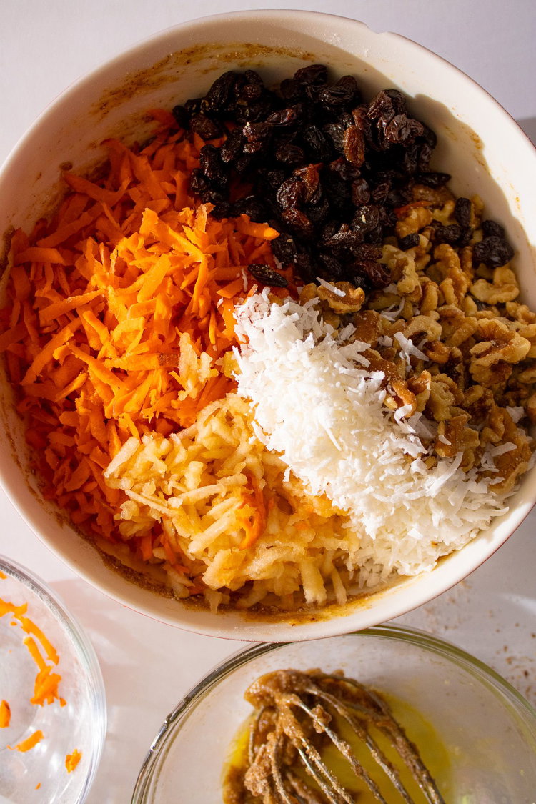 Image of Add in carrots, walnuts, coconut