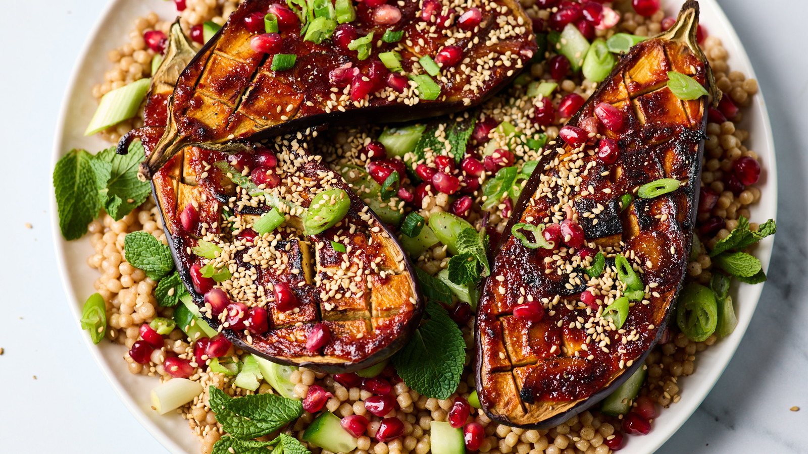Image of Lime Marmalade & Harissa Roasted Aubergine with Giant Couscous Salad