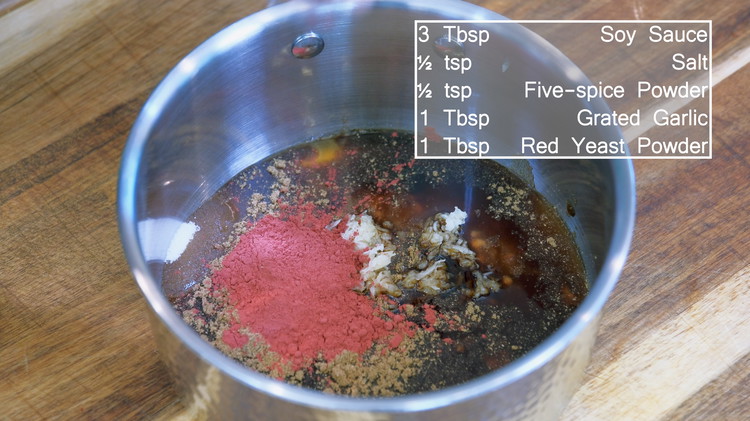 Image of Combine the sugar, honey, soy sauce, red fermented bean curd, salt, grated garlic, five-spice powder, and the red yeast powder in a saucepan. Smash the bean curd and thoroughly mix the sauce. 