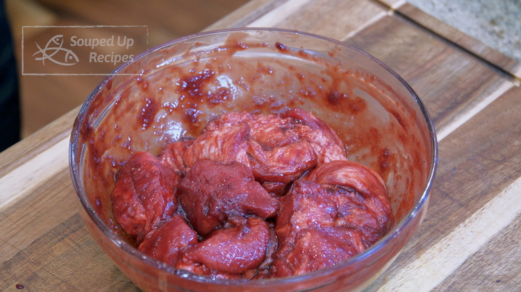 Image of Combine the pork with the char siu sauce in a big mixing bowl and mix thoroughly. If your room temperature is too cold, the char siu sauce will coagulate and become too sticky. You may need to reheat it over the...