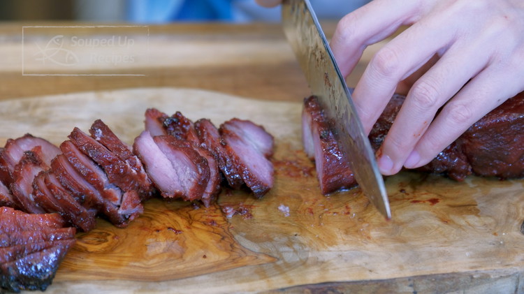 Image of Slice the char siu into thin pieces. Serve with a mound of white rice and some blanched choy sum on the side. Chef’s Secret: You can use char siu to make Cantonese Roasted Pork Char Siu Bun (see page ***)or add it...