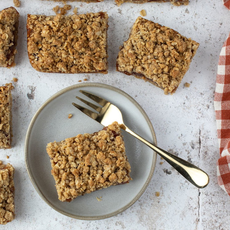 Image of Remove from the oven and cool completely in the tin to
ensure they are set firmly before slicing into squares or bars. You can also refrigerate
them first to make them less crumbly when slicing.