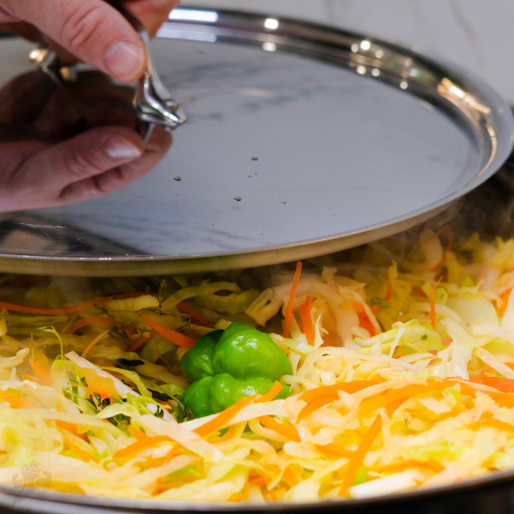 Image of Stir cabbage into the pan until thoroughly combined. Cover the skillet and reduce heat to medium-low; cook, stirring occasionally (every few minutes), until cabbage starts to soften and brown, about 10 minutes.