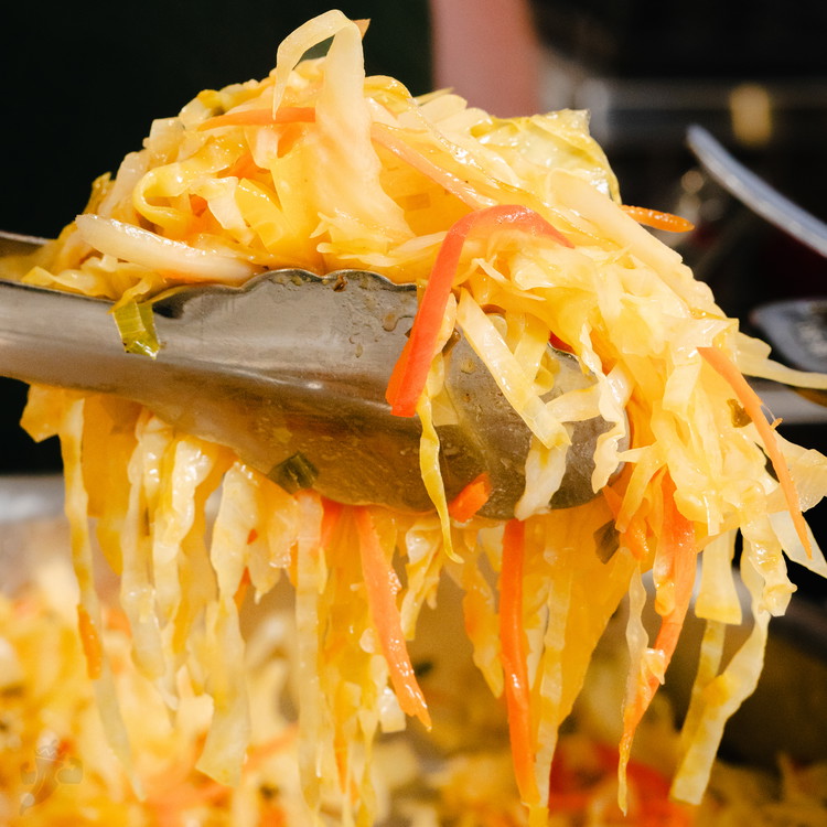 Image of Remove lid and stir in vinegar and sugar. Cook, uncovered, stirring occasionally, until cabbage is tender and most of the liquid has evaporated, about 3 more minutes. Taste and adjust for sour and sweet (vinegar and sugar). Discard Scotch bonnet...