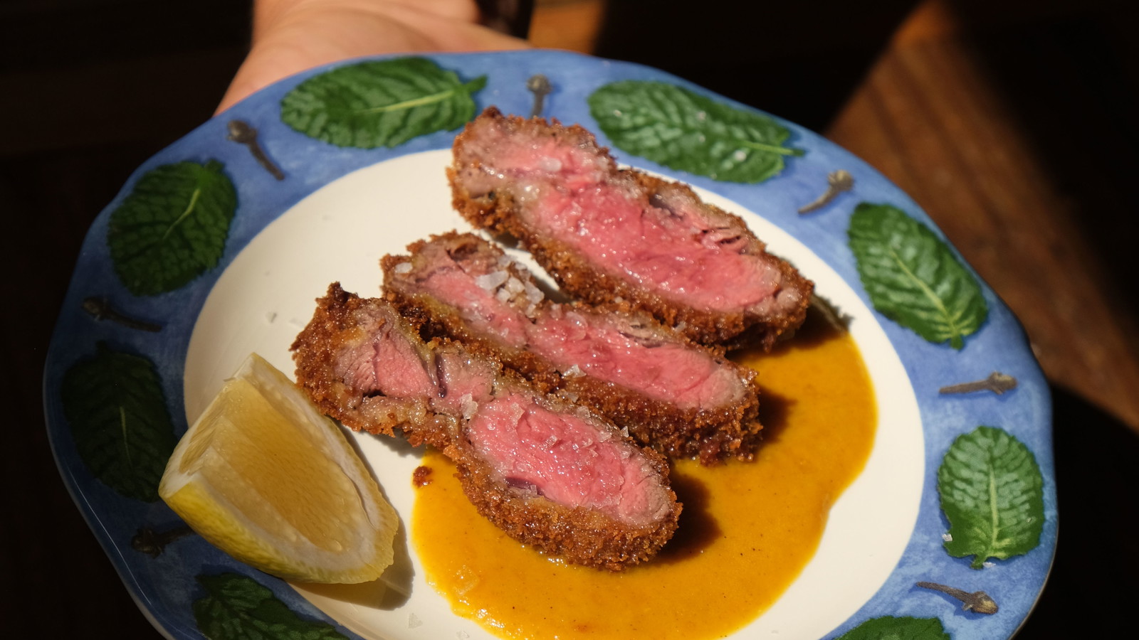 Ribeye Cap Katsu on a decorative plate with Curry sauce and lime