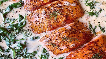 Image of Pan Seared Salmon in a Mustard Dill Cream Sauce with Spinach